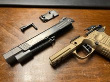 The only error I have on my personal gun is the reverse plug is .004 under flush with the face of the slide 
