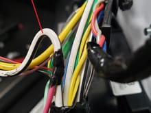 I used the thicker ground wire futher down in the harness because I did NOT want to tap into the tiny ground wire.  In this picture you can see my attached pink wire which is part of the ambient lighting connector.  