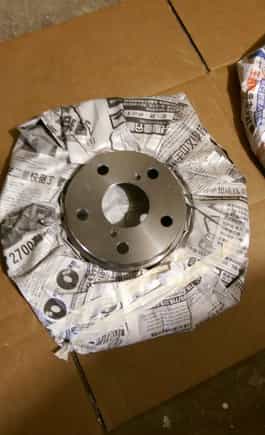 My fromt rotors had some a gap between the rotors and the hub so i just stuffed it in there make sure to tape down the news paper cause it might get in the way