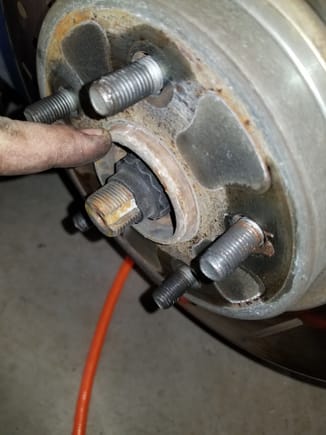 If the rotor doesn't pop loose, spray penetrating oil here.  Careful not to get it on the rotor surface.  If you do, use brake parts cleaner to clean it off.  Remove the rotor and set to the side out of the way.