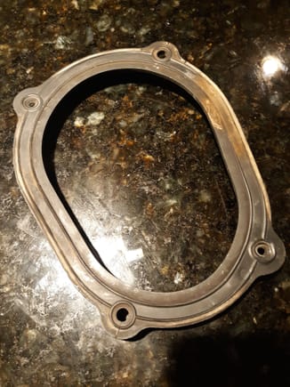 The metal frame extracted with separated rubber seal portion that simply dropped after removing nuts. The metal frame is whisper thin,and does not apply adequate tension across the longer span to seal the opening, as compromided by the large dust tracks. Two more fasteners would have prevented this. 