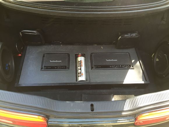 Trunk redone.  Still need to recenter and screw down but looks a ton better and subs sound great now that both are enclosed and sealed.  Subs are dual voice coil 4ohm.  I should have gotten 2ohm since the amp is stable down to 2ohm but the amp is still putting out enough to shake the car.