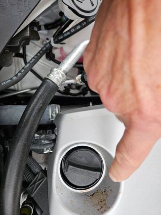 What looks to be oil spatter adjacent to the engine oil filler cap.