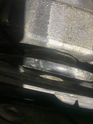 There is a gap between the bottom of the transmission and the top of the rear transmission support. 
