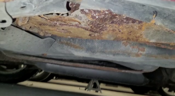 Rust at rear passenger side jack point.