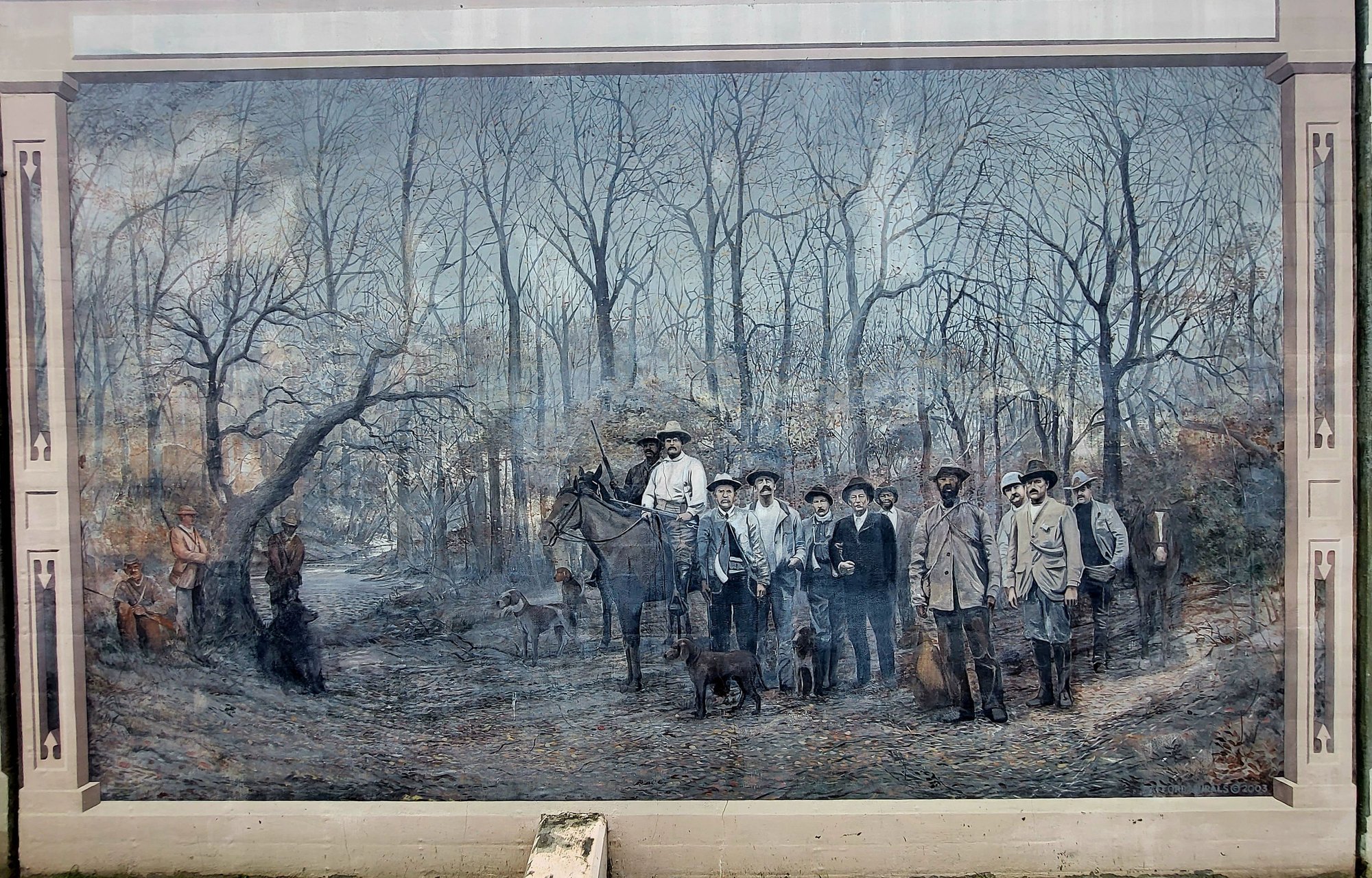 Mural Panel on the Vicksburg Dike featuring a scene of Teddy Roosevelt hunting a bear.  The story where he refused to shoot a tied up bear led to the stuffed animal known as a Teddy Bear.  