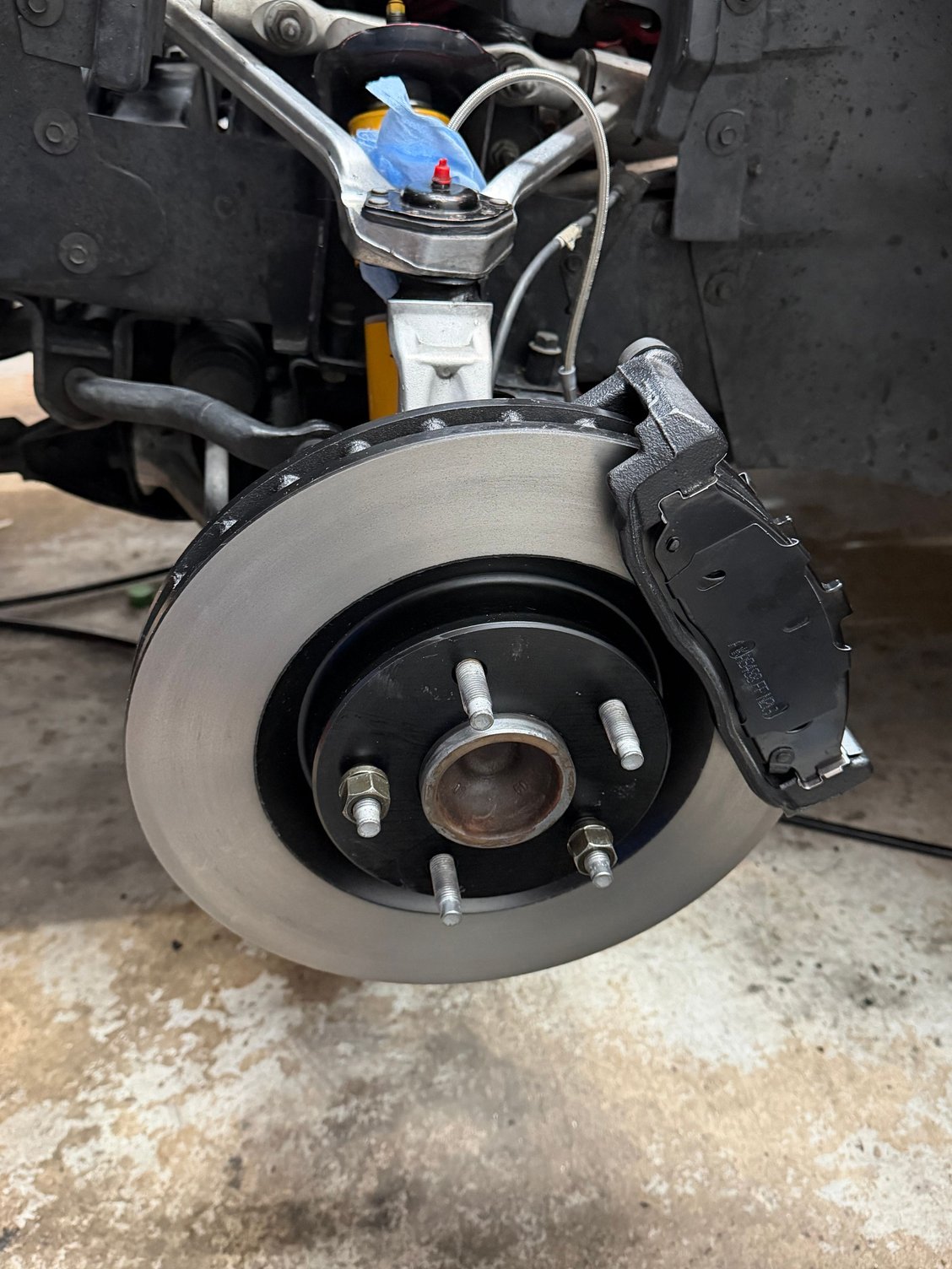 Some progress. At least the rotors are correct now. Calipers get painted tomorrow. 