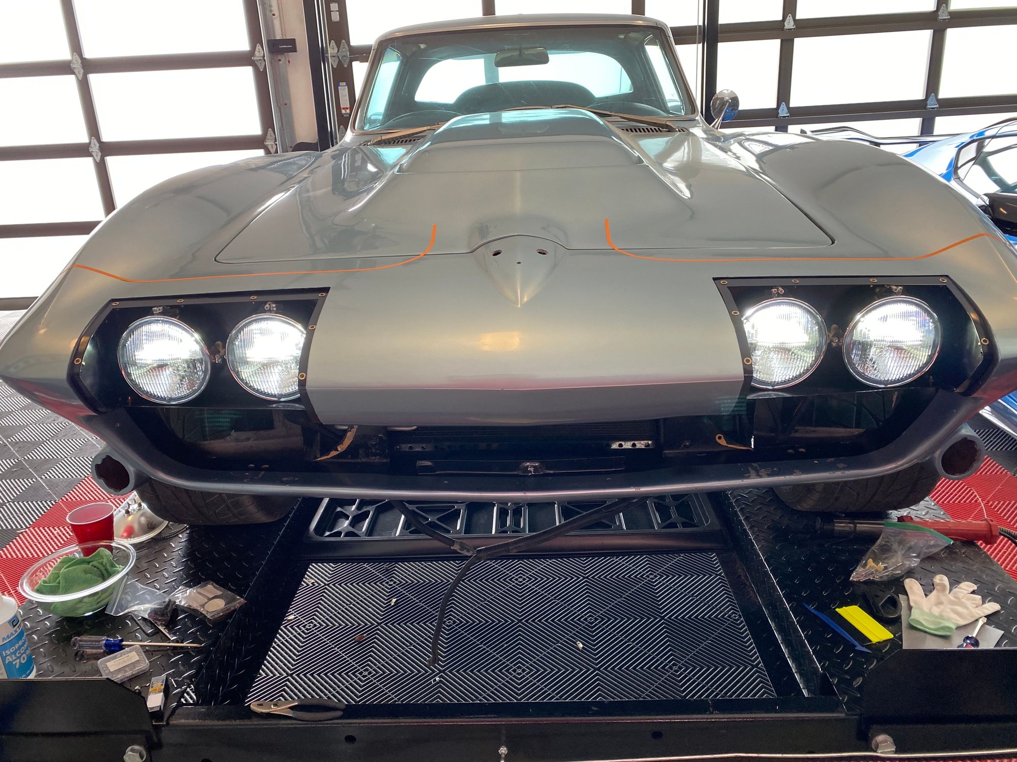 I used dual filament LED headlights from Summit. They are half the price of others and good quality. The orange tape lines are a rough mock up of my mustache and stripe plan.