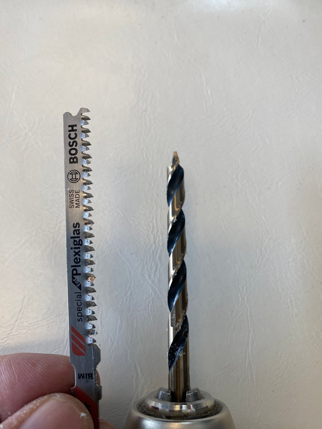 These two were godsends for this job. The plexiglass jigsaw blade ripped through the lexan like butter with virtually no heat. The plexiglass drill bit ensured a perfect hole with little chance of cracking.