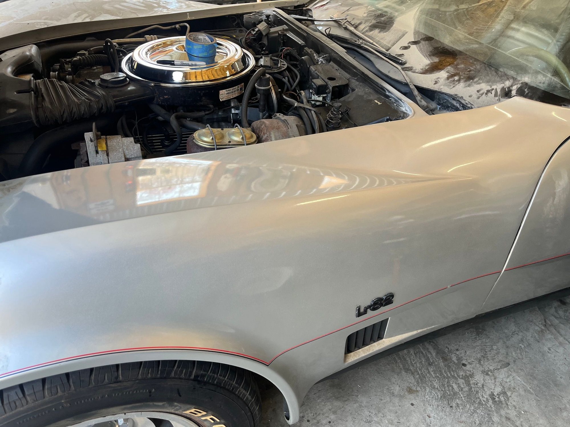 I cleaned one fender so far. To get the car outside will be a problem so thats why only 1 fender.  I needed to pull the plugs.  Paint looks good.