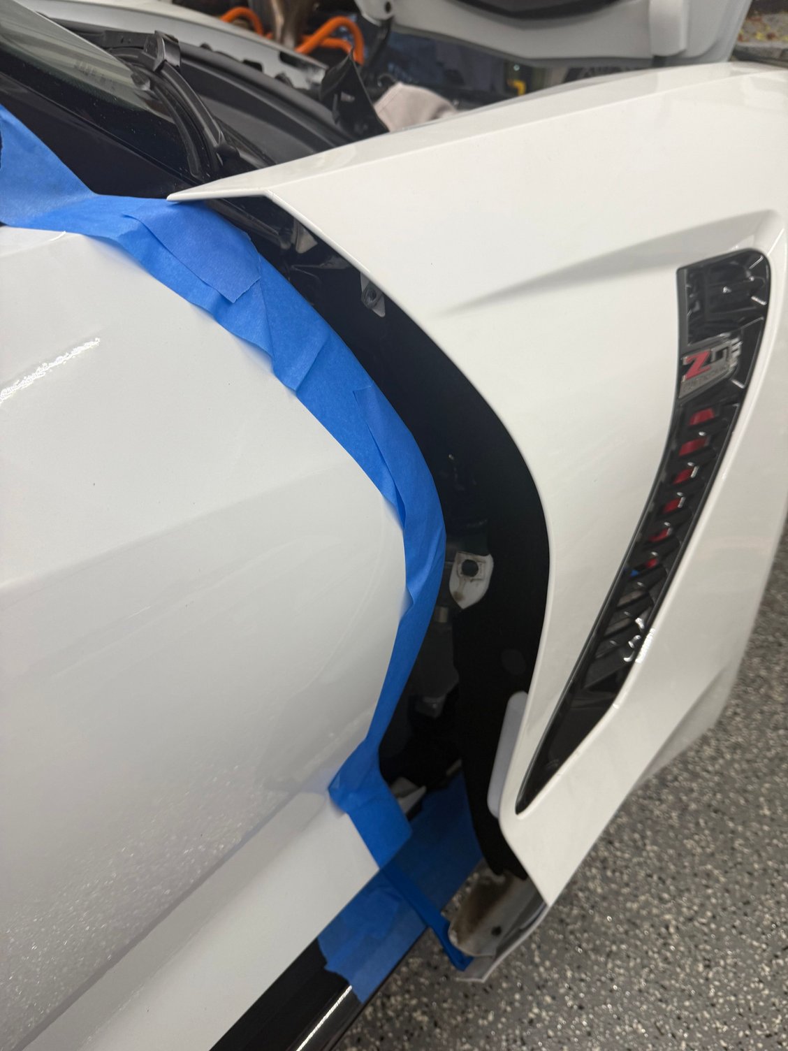 I slid the fender over the side skirt but added tape to it to protect it 