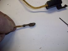 Pull the wire and lug out from the back while holding the tool down in the connector.