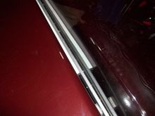 I drilled and tapped the 3/8” bar for ¼”x20 tpi all thread with the spacing matching the original holes in the deck lid front flange. Had to ream the holes in the fiberglass our about 1/32”.

Added a 7/16”x7/8”x28” thin steel (approx. 24 ga.) rectangular tube spacer behind a 3/8”x1”x 43” long aluminum bar to attach the hinge to.

Had to put individual shims at each end of the 3/8” aluminum bar as the deck lid curves in to keep the hinge mounting surface straight.
Put a 7/16”x7/8”x 43” long thin 