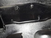 Two holes filled under Fender cross flag emblems.