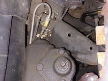 I disconnected the rear line at the distribution block and coupled it to a new line to the master cylinder. Then put a plug in the distribution block. I can easily revert back to the original master cylinder.