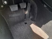 Hole in my floor mat after 80,000 miles. lol.