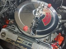 Prior to closing the hood. 