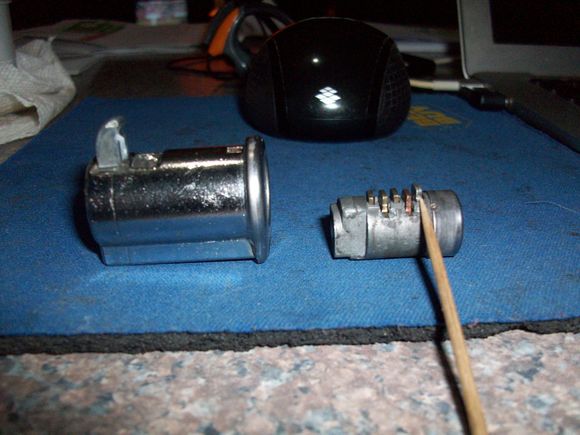 Metal pall retaining the lock cylinder (at the end of the toothpick)