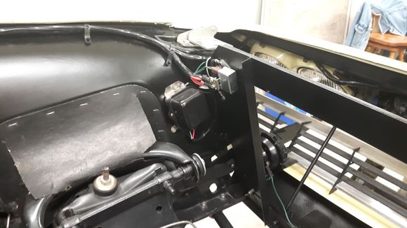 This is the way it was when I bought the car. But I have seen pictures where are the regulator is further back beside the alternator on the inner fender. Also no holes in the rad support 4 the voltage regulator.