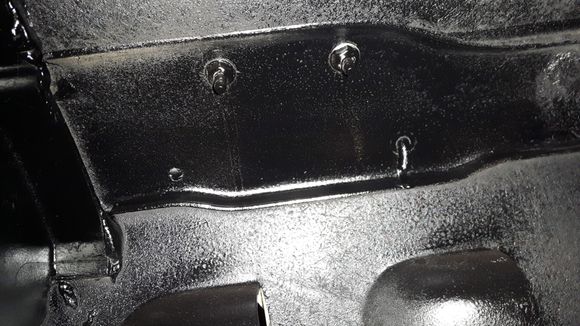 Two holes filled under Fender cross flag emblems.
