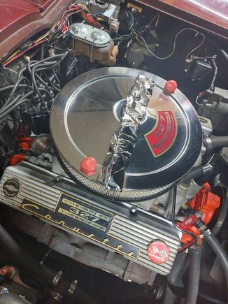 Prior to closing the hood. 