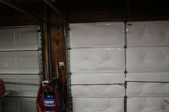 Insulated garage doors are 25 degrees cooler. Owens Corning kit. New compressor and upgraded 20 amp elec outlets.