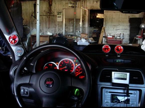 2005 Subaru STI Gauges: Boost, Wideband Air/Fuel Ratio, Oil pressure and Exhaust Gas Temperature. On the steering column there was a knock light.