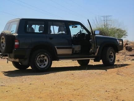 My Staff vehicle, a Nissan patrol 4.2L - diesel of course- right hand steering, manual tranny....