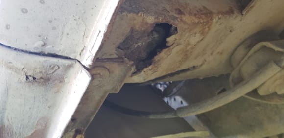 Not sure if you'd call this the subframe. It attaches to a think contoured Ibeam that supports the can. It's rusted to the point of being flexible. It's the only real rust I saw. 