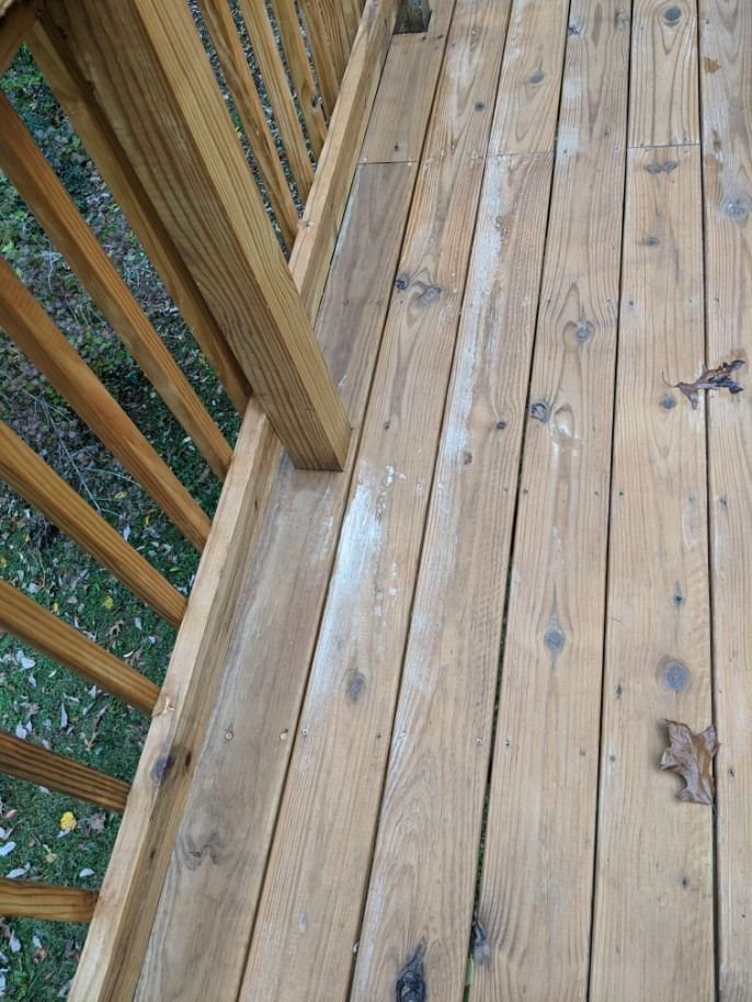 White splotches on newly stained deck after a rain (pics