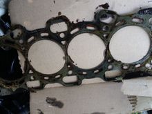 Yeah it really looks fried and defected guys. Ok also after I cleaned and prept the block I did take a good close look around the bolt holes and I could not find any cracks. So I'm hoping the gasket itself is the culprit