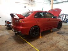 Wheel and wheel alignment complete. The extra long RED wheel nuts were a must.
