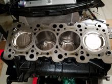 All pistons in their new (old) home.  All rings clocked properly