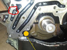 Oil regulator dump location (Rear right-hand side of engine). During heavy acceleration or Right-Hand corners, there is no way this dumped oil will get back to the pickup.