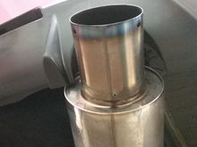 The JDM rear fascia does contact the exhaust.  It will need to be shortened.