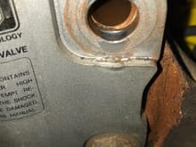 The passenger side ecentric of the bolt started wearing a hole into the strut mount. 