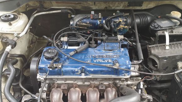 Before pic, unsightly and defected valve cover. Even from this distance you can see the gap between the middle bolt going to our right.