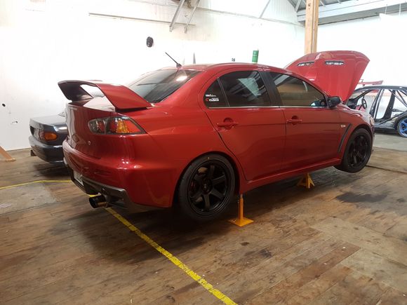 Wheel and wheel alignment complete. The extra long RED wheel nuts were a must.