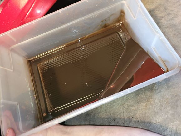 Fluid after drain and about half a quart of mtl