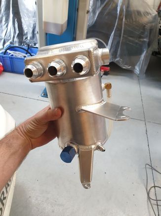 New catch can with 3x 12AN ports, 10AN drain and 4AN drain. The 4AN drain hooks into the front balance shaft inspection hole port for passive draining (when the car is off). This drains *really* slow.