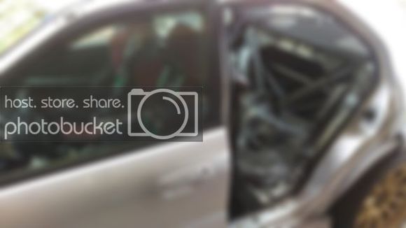 Removed rear drivers side door and back seats to begin Cusco cage install of the main hoop