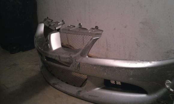 its all dirty still in this picture.. but i FINALLY got a stock bumper!!