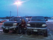 my lovely gf next to my truck and the chevy at the theater