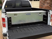 Small truck tool box mounted to the bed extender...