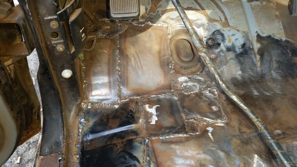 Driverside floor and rocker panel set and welded in place