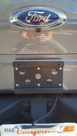 Painted and riveted to the tailgate