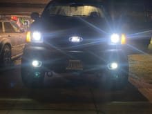 Atlanta custstom headlights with morimoto projectors and signal changing halos with demon eyes