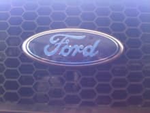 Ford logo covered in painters tape