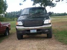 Not A Guys Truck! 2002 Ford F-150 Triton Lariat Supercrew FX4.... Some mod's done that include K&amp;N air intake, bed cover, customs grill (thanks to my awesome husband who can do anything) removed runners. Soon to come a lift with tires and wheels then dual exhaust with custom tips (that awesome fabricator husband again)....