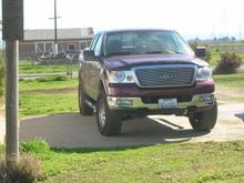 Truck with 2" leveling kit and 33x12.50x18 Toyo MT's